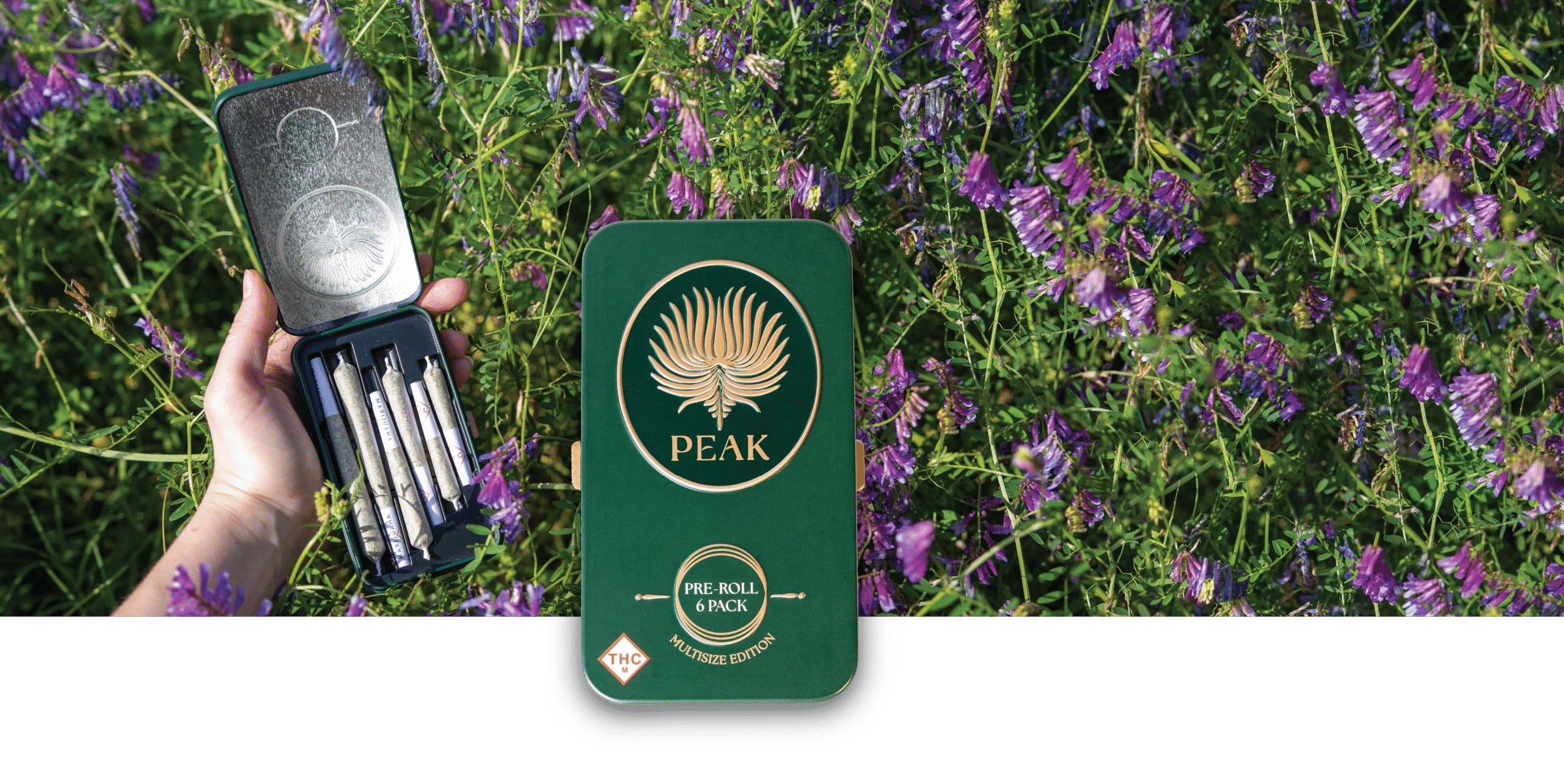 Open Peak Pre-roll tin in a field