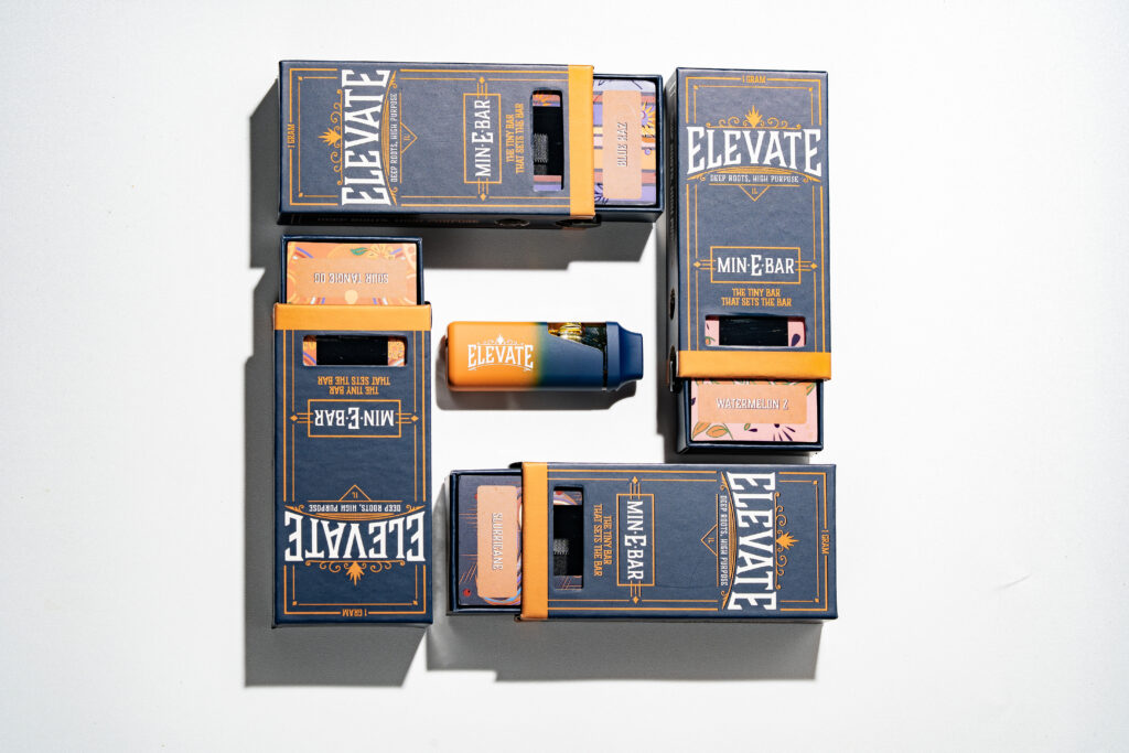 Elevate Cannabis Min-E-Bar vape packages arranged in a square with one Min-E-Bar in the middle.